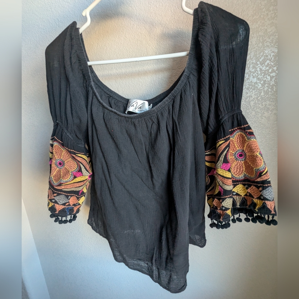 Off shoulder black top with embroidered sleeves